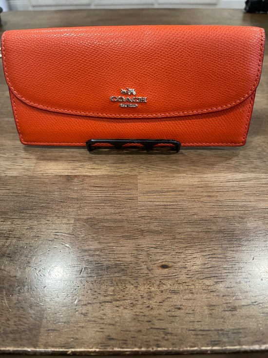 Coach Handbags - Coach Orange Leather Flap Wallet With Brown Signature Coach Interior